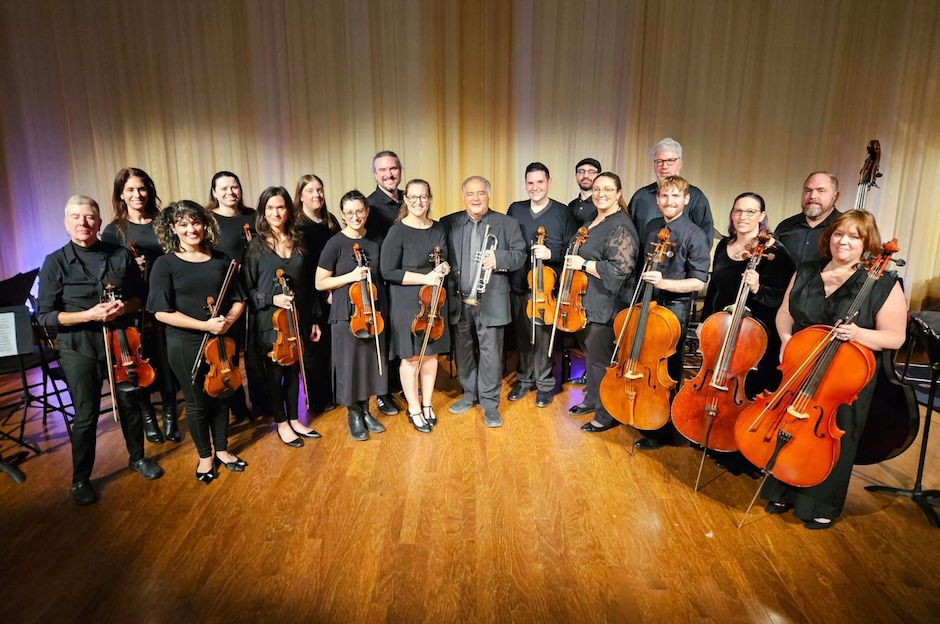 orchestra members holding instruments