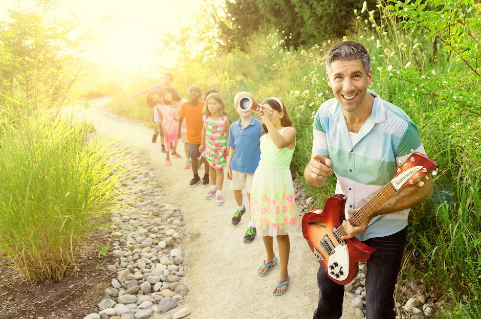 man with guitar and kids