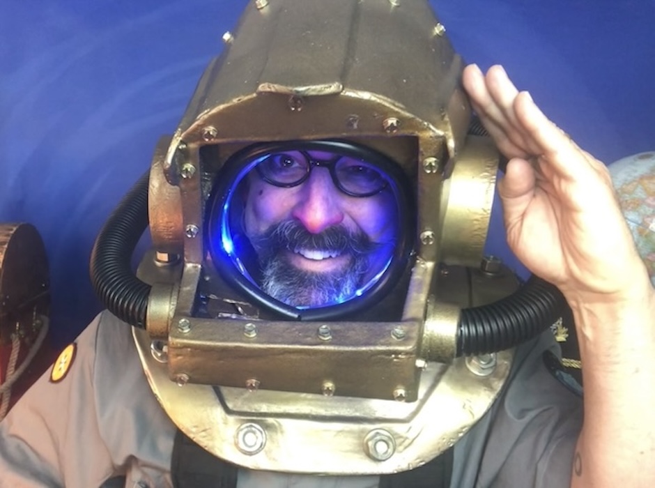 man wearing an old scuba helmet