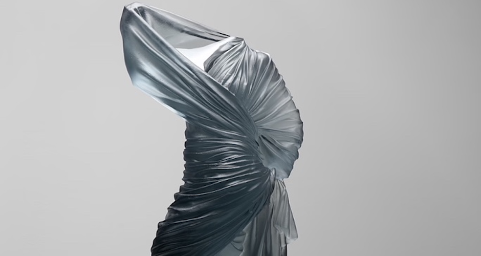 Form of woman standing, just glass dress providing form