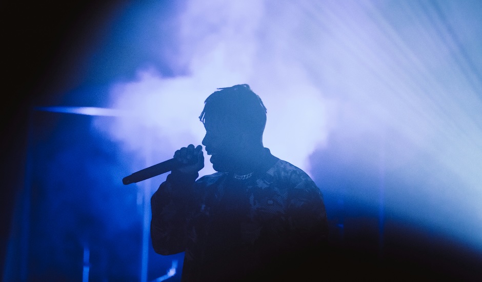 person on stage singing