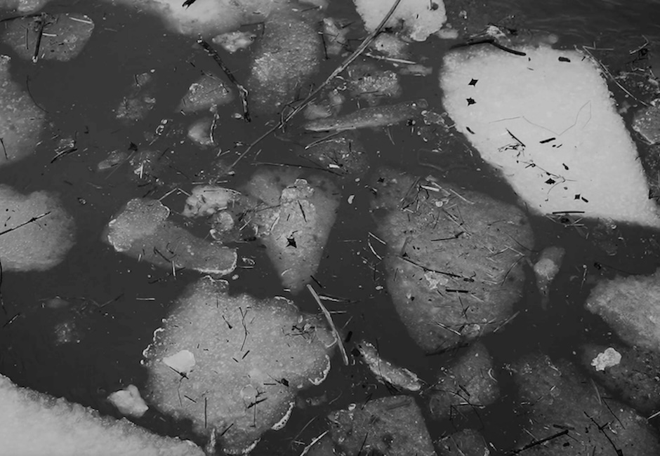 close up ice breaking black and white image still from video