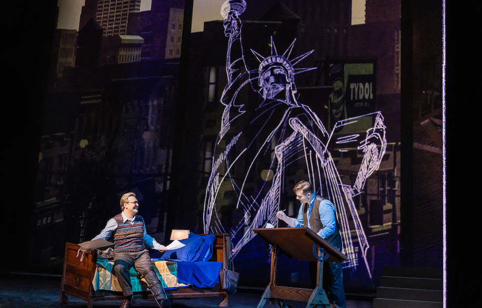 men on a stage performing an opera about a comic book being created