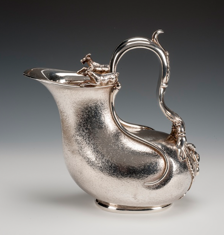 silver pitcher with rams
