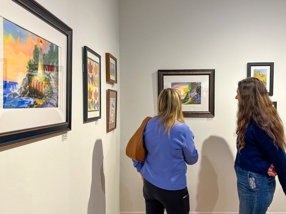 people looking at art