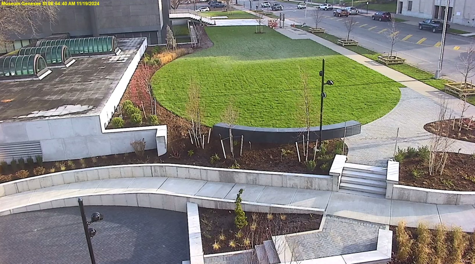 View of Genesee Street front lawn, the ramp is mostly completed and the trees and shrubs are planted.