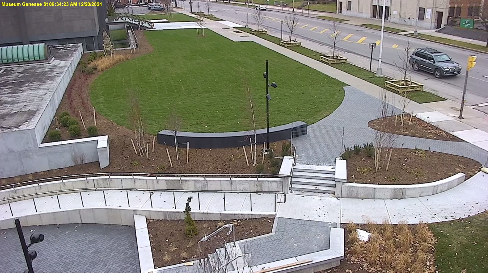 View of Genesee Street front lawn, the ramp is mostly completed and the trees and shrubs are planted.