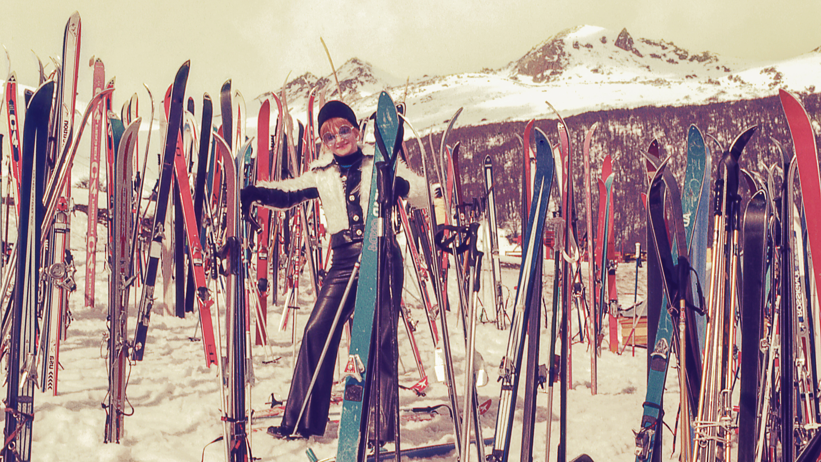 Vintage woman in front of skis