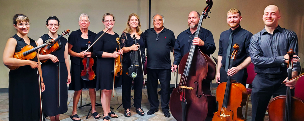 group of orchestra players with their instruments